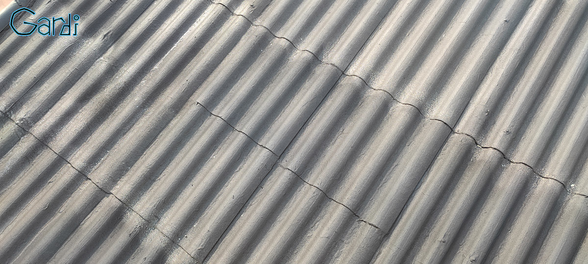 Réhabilitation de l'étanchéité de plaques sous toiture en amiante